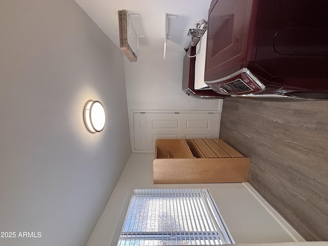 interior space featuring stacked washer / dryer