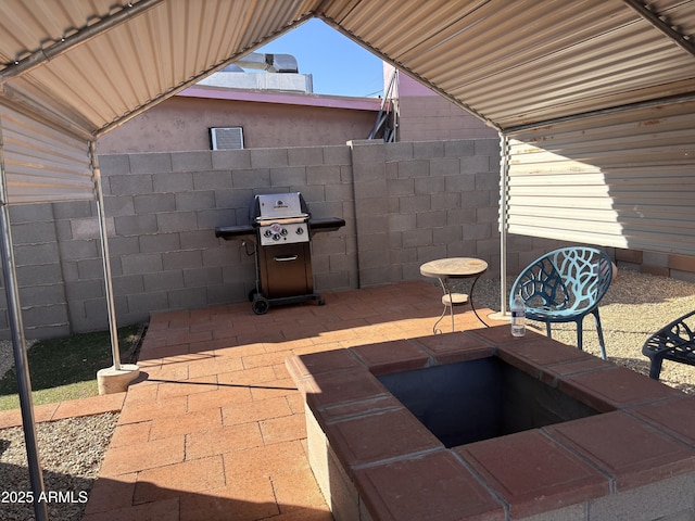 view of patio with a grill