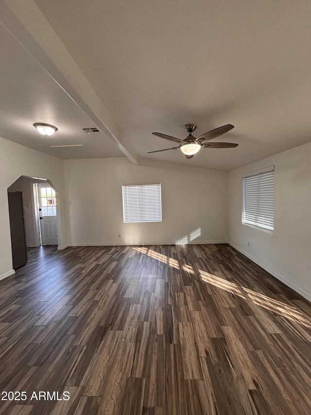 spare room featuring dark hardwood / wood-style flooring and ceiling fan