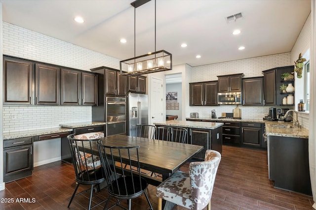 dining area featuring dark hardwood / wood-style flooring and sink