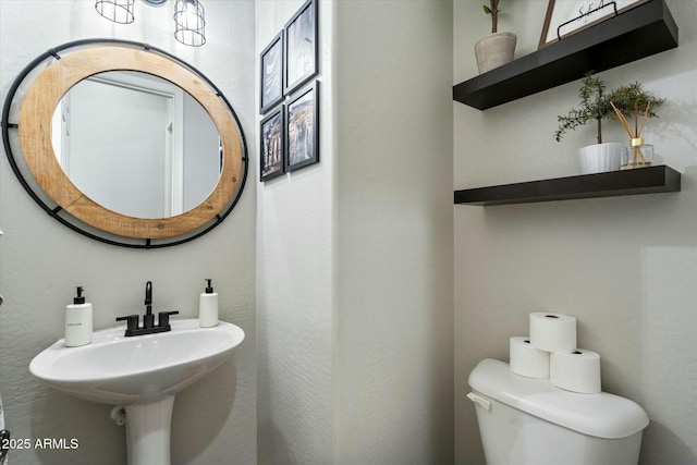 bathroom with sink and toilet