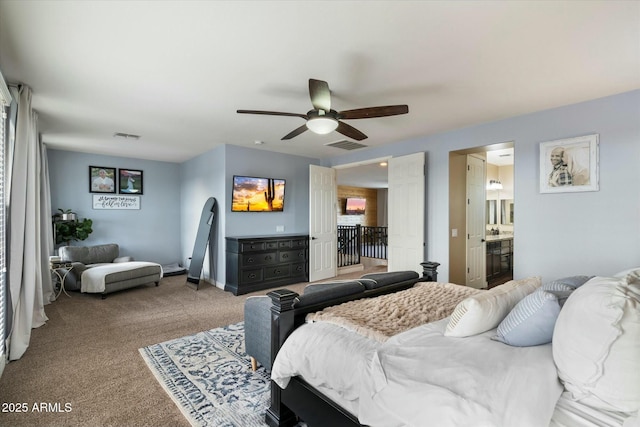 bedroom featuring carpet floors, ceiling fan, and ensuite bathroom