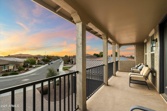 view of balcony at dusk