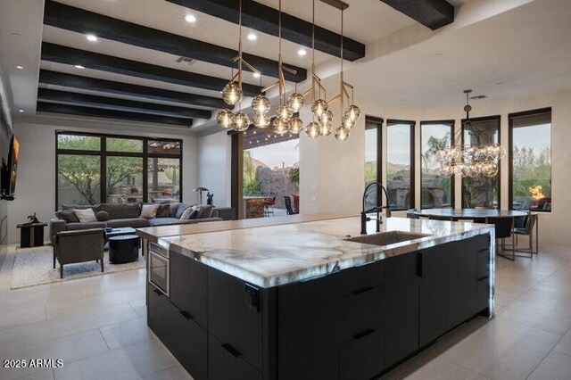 26285 N 89th St, Scottsdale, AZ 85255 - kitchen with dark cabinetry, modern cabinets, a chandelier, a sink, and beamed ceiling