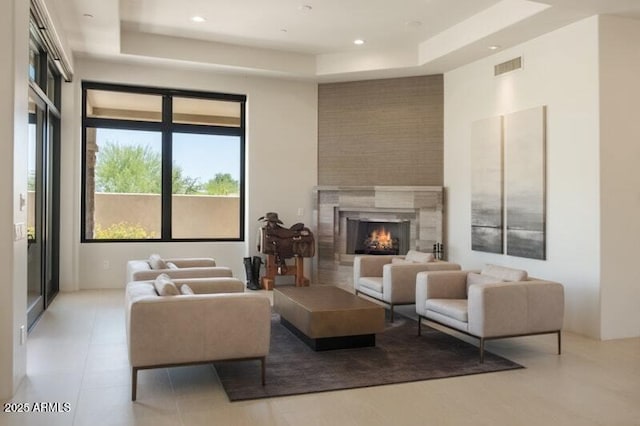 26285 N 89th St, Scottsdale, AZ 85255 - living room with a tray ceiling, a high end fireplace, and recessed lighting