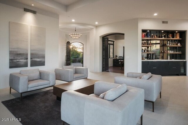 26285 N 89th St, Scottsdale, AZ 85255 - living area with arched walkways, bar area, and recessed lighting