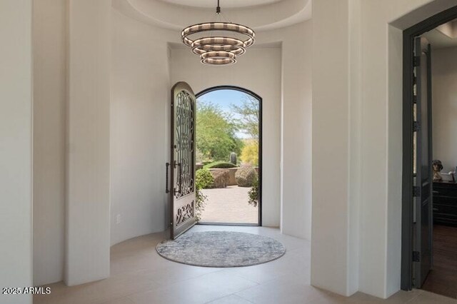 26285 N 89th St, Scottsdale, AZ 85255 - entrance foyer featuring a chandelier and tile patterned flooring