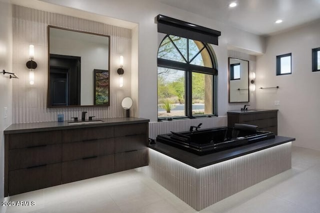 26285 N 89th St, Scottsdale, AZ 85255 - full bath with tile patterned flooring, two vanities, decorative backsplash, a bath, and recessed lighting