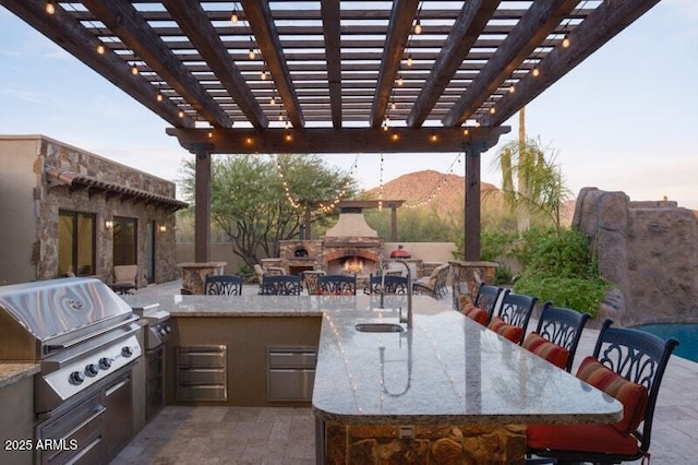 26285 N 89th St, Scottsdale, AZ 85255 - view of patio / terrace featuring an outdoor stone fireplace, an outdoor bar, and a pergola