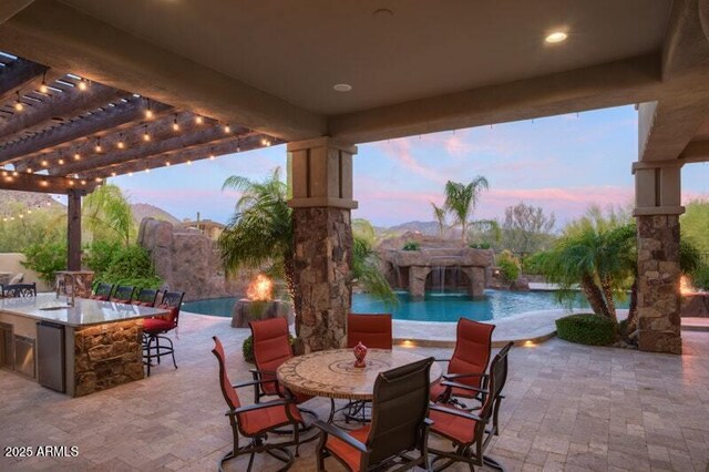 26285 N 89th St, Scottsdale, AZ 85255 - patio terrace at dusk with a pergola, an infinity pool, and a patio area