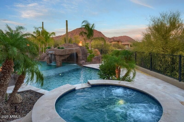 26285 N 89th St, Scottsdale, AZ 85255 - pool at dusk featuring a pool with connected hot tub and a mountain view