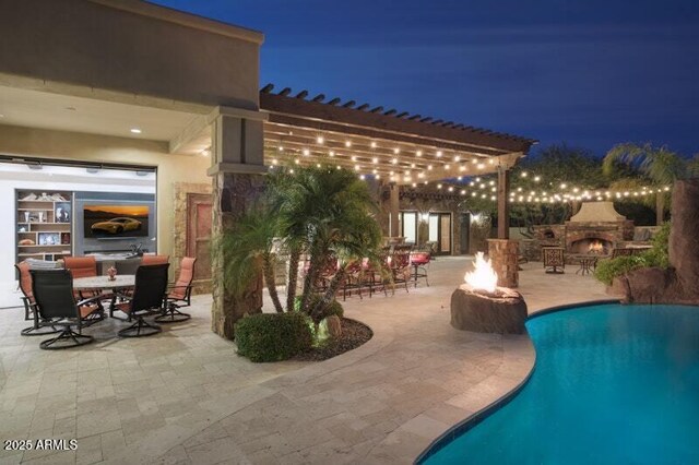26285 N 89th St, Scottsdale, AZ 85255 - pool at twilight featuring a patio area, an outdoor stone fireplace, an outdoor pool, a fire pit, and a pergola