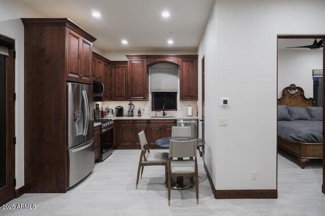 26285 N 89th St, Scottsdale, AZ 85255 - kitchen with appliances with stainless steel finishes, backsplash, recessed lighting, light countertops, and baseboards