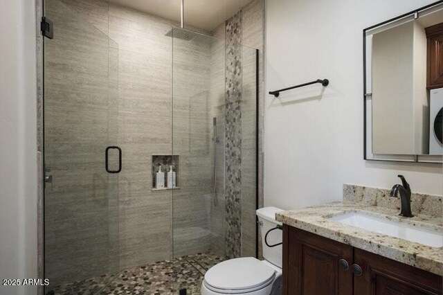 26285 N 89th St, Scottsdale, AZ 85255 - bathroom featuring vanity, a stall shower, toilet, and washer / dryer