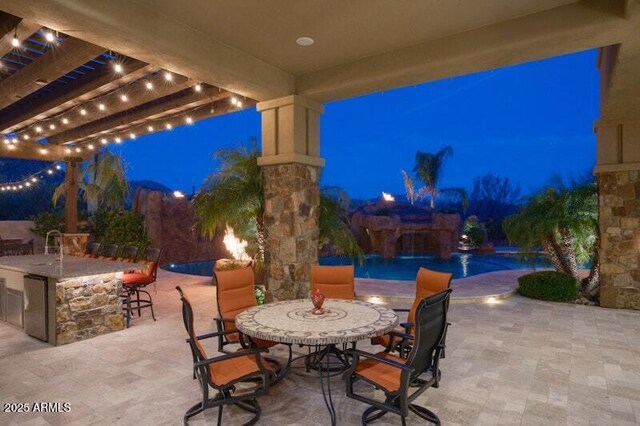 26285 N 89th St, Scottsdale, AZ 85255 - patio at night featuring a patio, a pergola, and an infinity pool