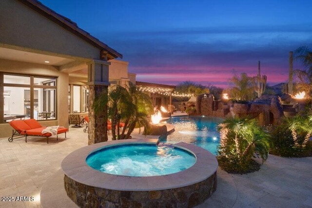26285 N 89th St, Scottsdale, AZ 85255 - pool at dusk with a patio and a pool with connected hot tub