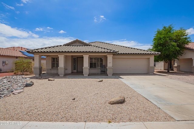 10001 W Potter Dr, Peoria, AZ 85382 - view of front of house featuring stucco siding, an attached garage, a tile roof, a porch, and concrete driveway