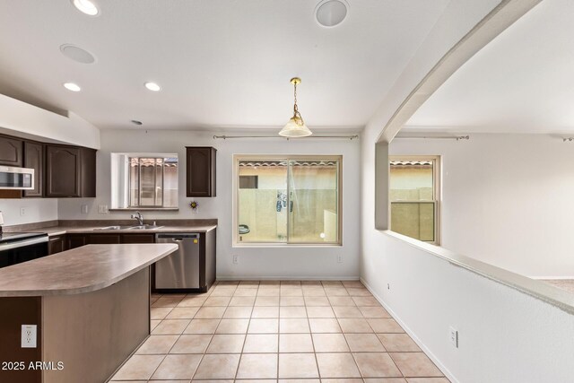 10001 W Potter Dr, Peoria, AZ 85382 - kitchen with appliances with stainless steel finishes, a sink, healthy amount of natural light, dark brown cabinets, and recessed lighting