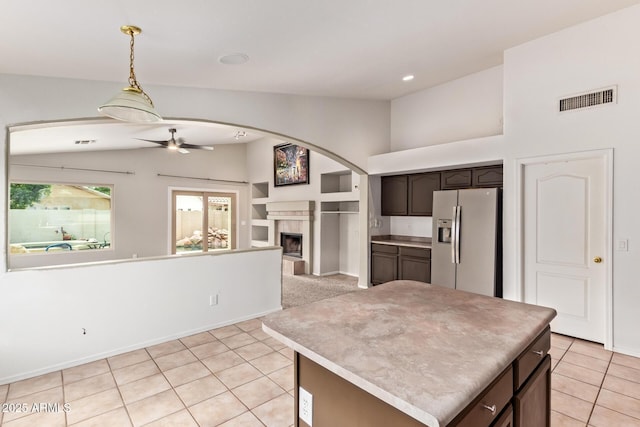 10001 W Potter Dr, Peoria, AZ 85382 - kitchen featuring stainless steel fridge, light tile patterned floors, open floor plan, dark brown cabinetry, and ceiling fan