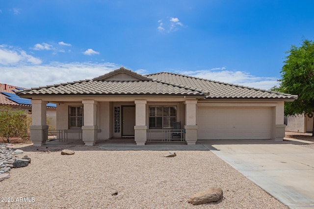 10001 W Potter Dr, Peoria, AZ 85382 - view of front of property with covered porch, stucco siding, an attached garage, concrete driveway, and a tiled roof