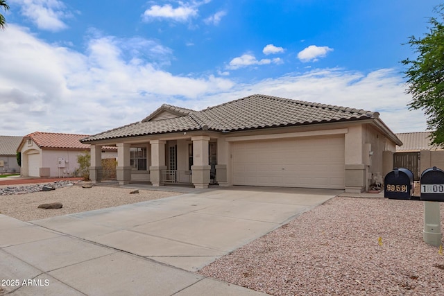 10001 W Potter Dr, Peoria, AZ 85382 - view of front facade with stucco siding, a porch, a garage, driveway, and a tile roof
