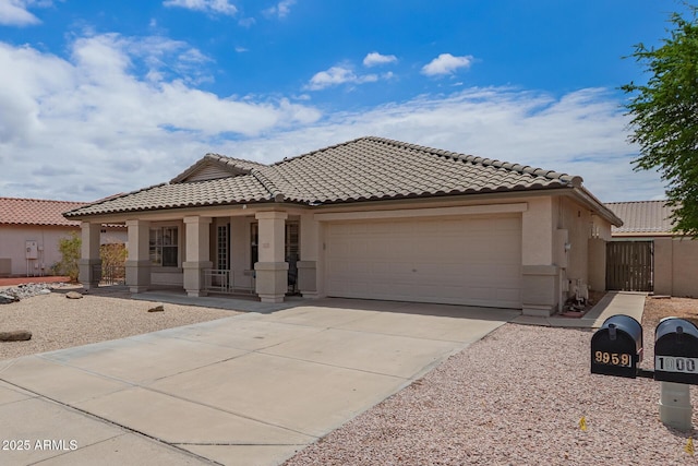 10001 W Potter Dr, Peoria, AZ 85382 - view of front of house with stucco siding, an attached garage, a tiled roof, and a porch