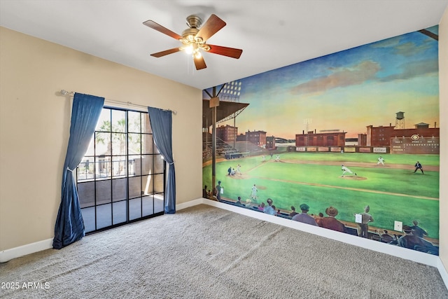 unfurnished room featuring baseboards, ceiling fan, and carpet flooring