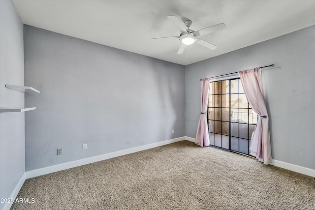 carpeted empty room with a ceiling fan and baseboards