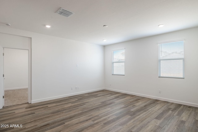 unfurnished room featuring dark hardwood / wood-style flooring