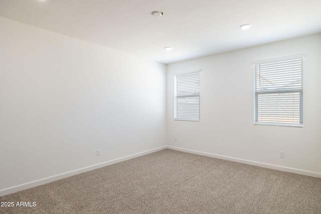 spare room with carpet floors