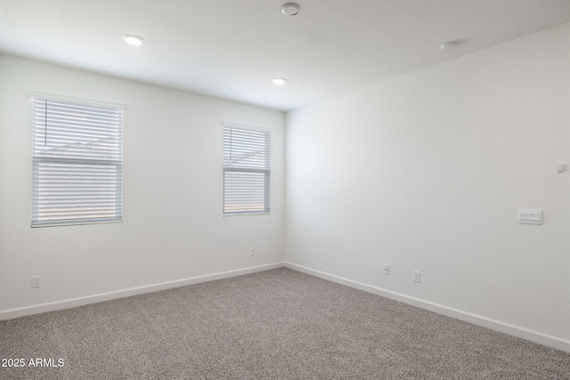 empty room with carpet flooring