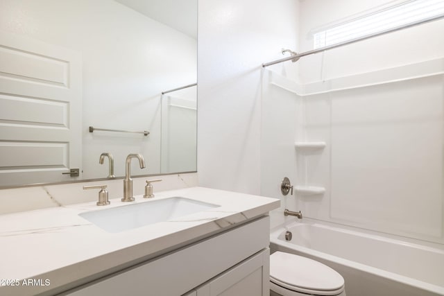 full bathroom with bathtub / shower combination, vanity, and toilet