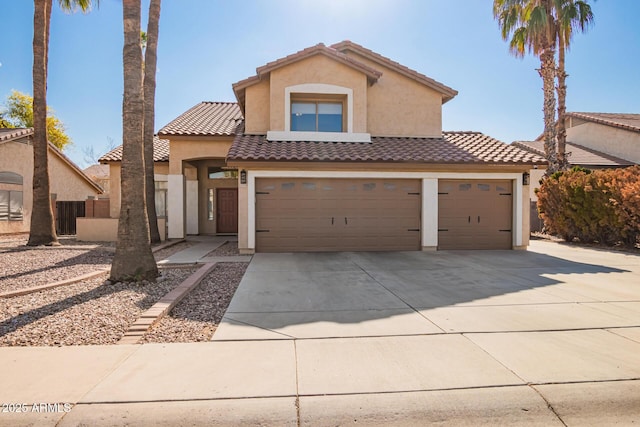 mediterranean / spanish house featuring a garage