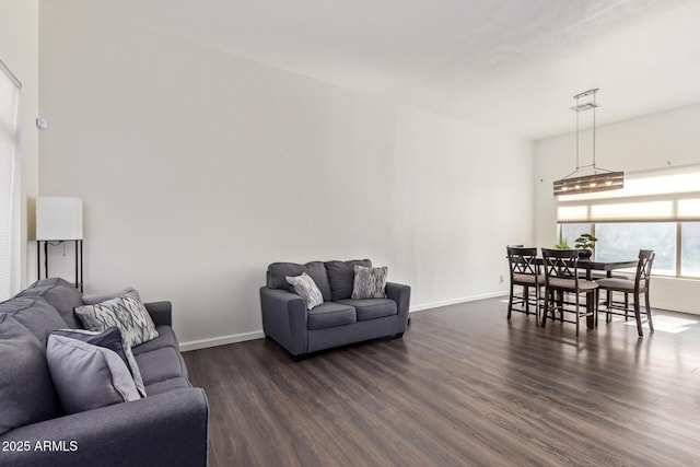 living room with dark hardwood / wood-style flooring