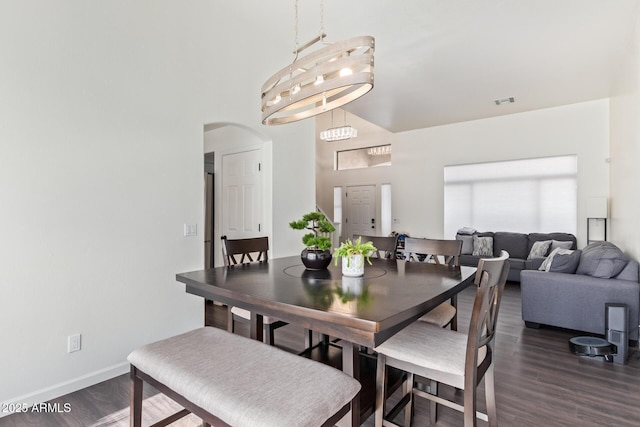 dining space featuring dark hardwood / wood-style floors