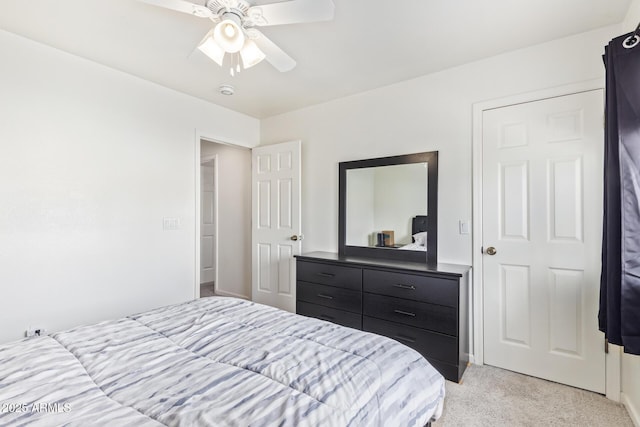 bedroom featuring ceiling fan and light colored carpet