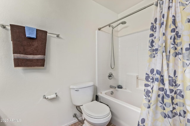 bathroom featuring toilet and shower / bath combo