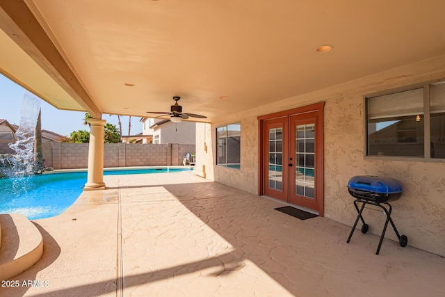 view of swimming pool with french doors, pool water feature, area for grilling, ceiling fan, and a patio