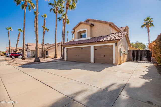 mediterranean / spanish-style home featuring a garage