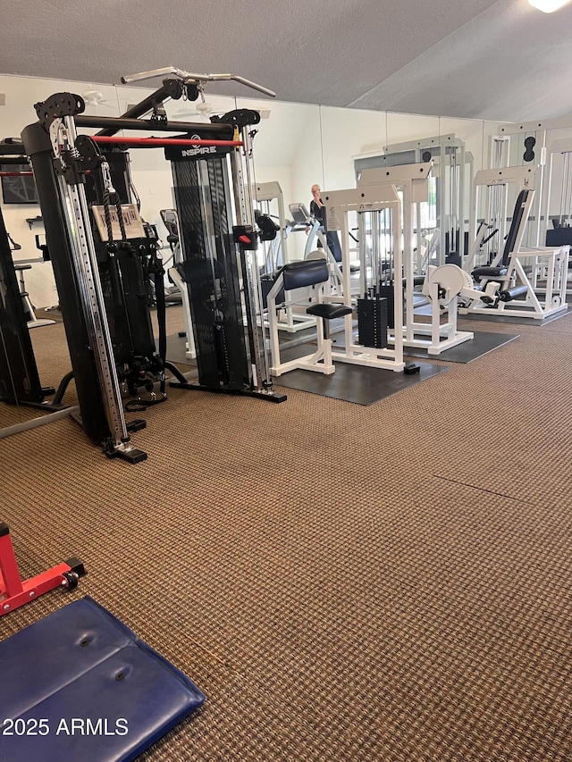 gym featuring a textured ceiling