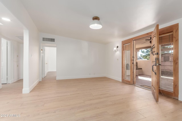 unfurnished room featuring light hardwood / wood-style flooring