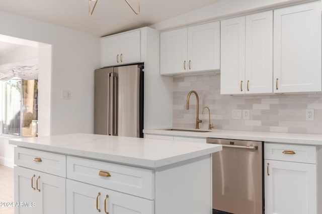 kitchen featuring sink, white cabinets, and stainless steel appliances