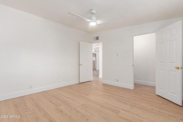 unfurnished bedroom with a closet, ceiling fan, and light hardwood / wood-style flooring