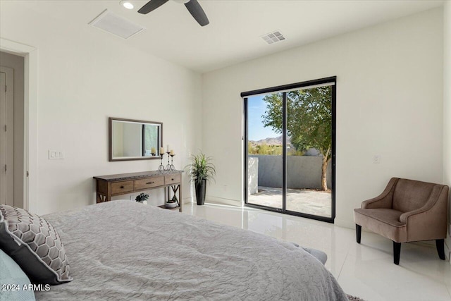 tiled bedroom with ceiling fan and access to exterior