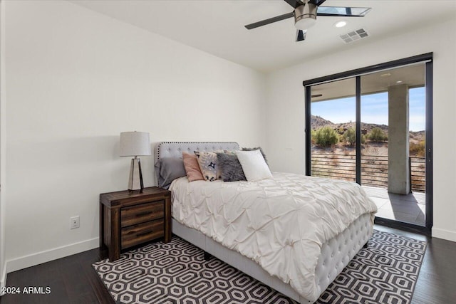 bedroom with ceiling fan, dark hardwood / wood-style flooring, and access to outside