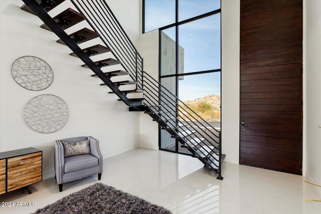 stairs with tile patterned floors