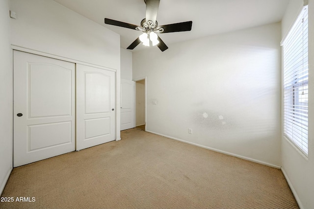 28604 N 21st Ln, Phoenix, AZ 85085 - unfurnished bedroom featuring a ceiling fan, light carpet, baseboards, and a closet