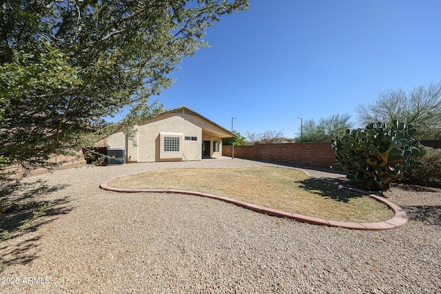 28604 N 21st Ln, Phoenix, AZ 85085 - rear view of house featuring a patio area, central air condition unit, stucco siding, and fence