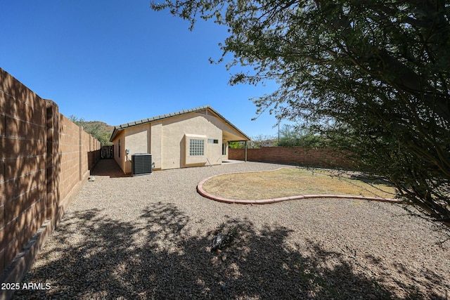 28604 N 21st Ln, Phoenix, AZ 85085 - back of property with stucco siding, central AC unit, and a fenced backyard