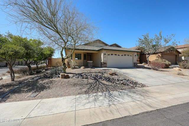 28604 N 21st Ln, Phoenix, AZ 85085 - view of front facade with stone siding, stucco siding, concrete driveway, and a garage